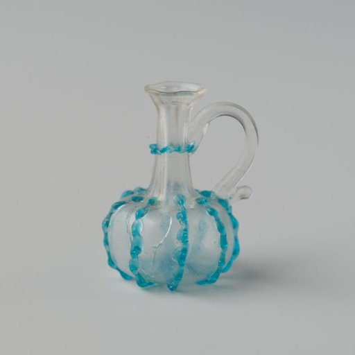 Jug of clear colourless glass, globular body decorated with eight blue pinched vertical applied ribs and a slightly indented pontil mark.