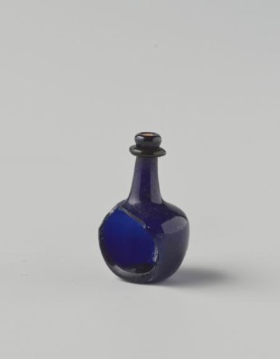Bottle of clear, deep blue glass; body with few impressed eyes, high neck with drip ring (part of body missing). Cork in the neck opening.