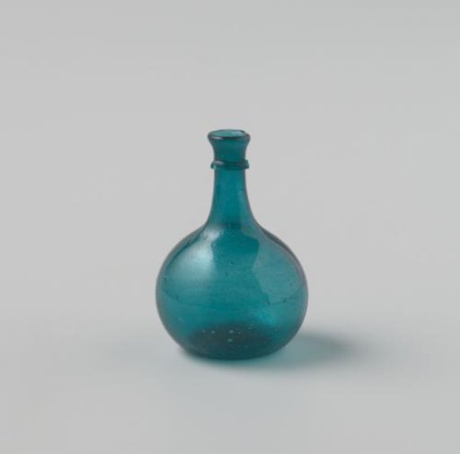 Bottle of clear azure blue glass; body with impressed eyes, high neck with drip ring.