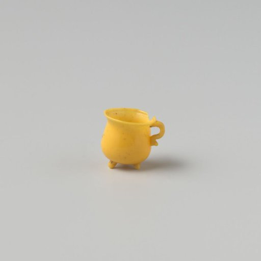 Cooking jug of opaque yellow glass (probably imitation yellow earthenware); on three feet with spout and handle.
