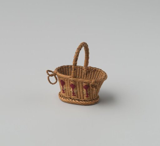Oval handle basket of split willow (fine wickerwork), embroidered on one side with floral motifs.