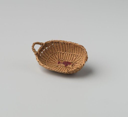 Low oval basket of split willow, fine wickerwork, with (originally two) handles, reinforced with dark horsehair (?); base embroidered with a floral motif.