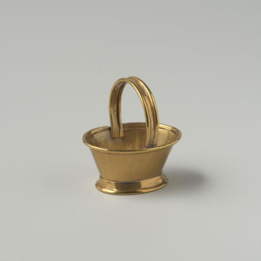 Brass market measure; oval, widely flaring high bowl with fixed handle, on a widely flaring foot ring, all edges turned inward