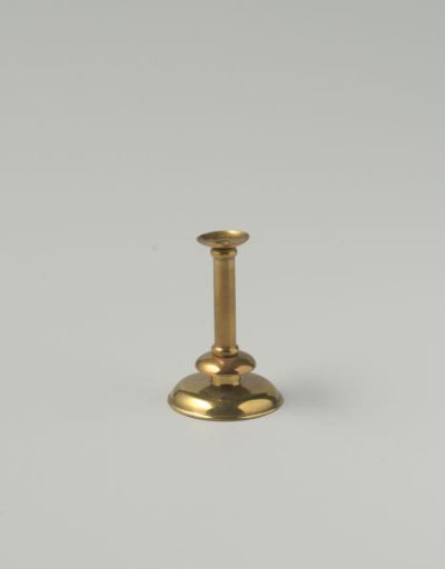 Copper candelabrum, consisting of a broad base with a piece of stem with two profiles and a candlestick with a drip pan