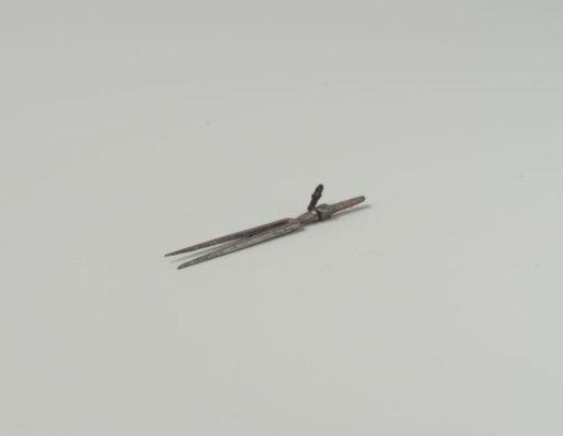 Meat fork of wrought iron with profiled stem, to which the original handle (of another material) is missing