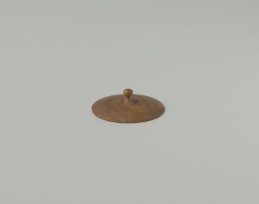 Round lid with knob and flat underside, turned from maple wood. Possibly the lid for the commode seat