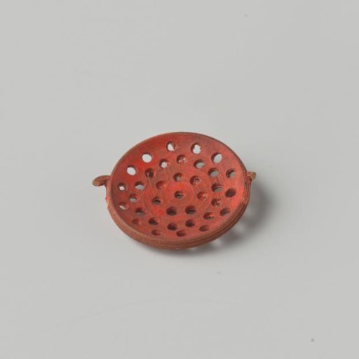 Low round sieve of red lacquered wood; originally with two handles and on three low feet (handles and one foot missing)