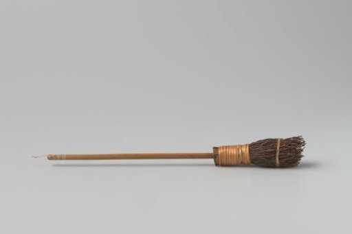 Broom, consisting of a bundle of twigs bound with willow twine, into which is inserted a smooth stem of pine wood with five profiled rings at the top (for cords)