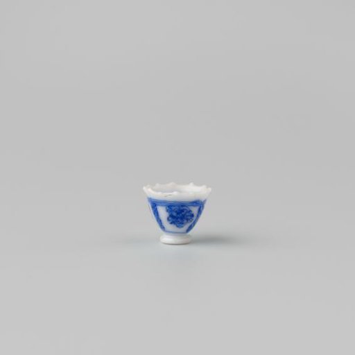 Milk glass teacup with blue enamel painting, imitation Chinese porcelain with 'flower' decoration in panels; model on a separately attached foot ring with a pointed rim.
