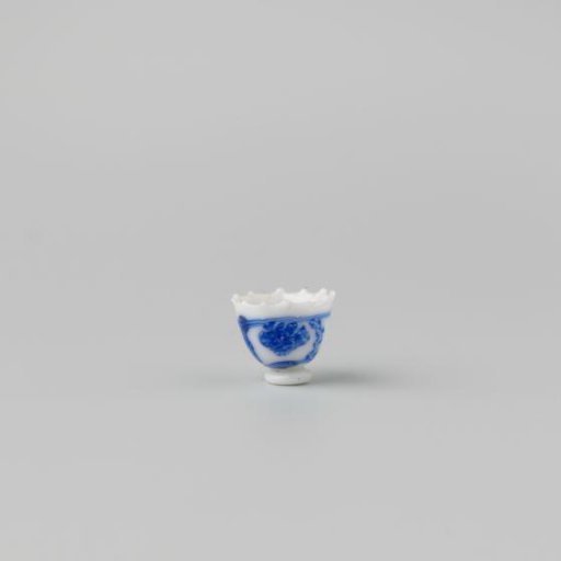 Milk-glass teacup with blue enamel painting, imitation Chinese porcelain with 'flower' decoration in compartments; model on a separately attached foot ring with a pointed rim.