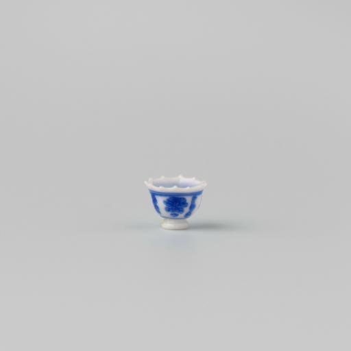 Milk-glass teacup with blue enamel painting, imitation Chinese porcelain with 'flower' decoration in compartments; model on a separately attached foot ring with a pointed rim.