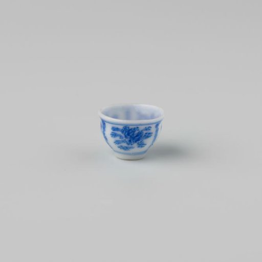Milk-glass teacup with blue enamel painting, imitation Chinese porcelain with 'flower' decoration in panels; on a stand ring and with a smooth rim.