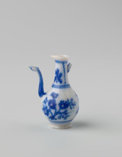 Milk-glass jug with blue enamel painting, imitation Chinese porcelain; decoration of two flower branches on the body and flowers in two panels on the neck. Pear-shaped.