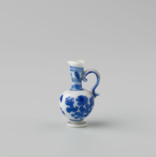 Milk-glass jug with blue enamel painting, imitation Chinese porcelain; flowers in panels; model a knobbly flask on a stand ring with spout and S-shaped handle.