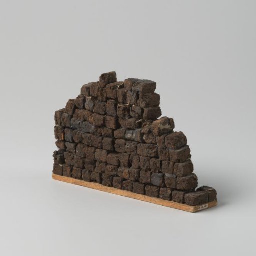 Plank with a stack of turf briquettes