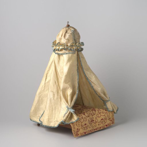 Conical pavilion, made of light yellow (taffeta) silk, trimmed with a gathered light blue silk ribbon