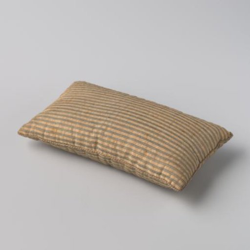 Mattress of blue-white striped linen and cotton weave.