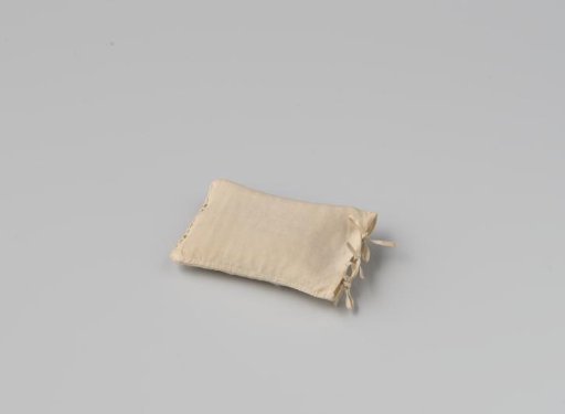 Cushioncase of white linen with an insertion on one side