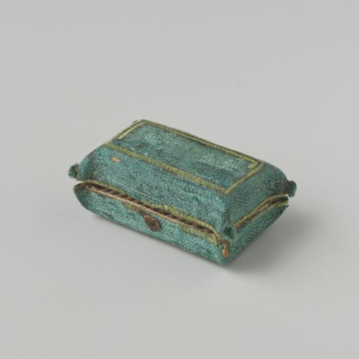 Sewing cushion, base form made of a rectangular box of pasteboard with a hinged lid, outside covered with green silk damask.