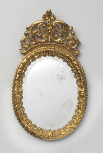 Oval mirror in a gilded bronze frame. In the frame an old, barely corroded mirror glass with cut facet edge, at the back closed by wooden panel