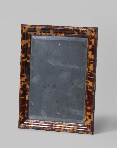 Rectangular mirror in a finely profiled tortoiseshell frame, in the frame original strongly corroded mirror glass with cut facet edges, original projecting eye