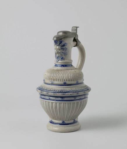 Jug with a mask, fluting and chip carving