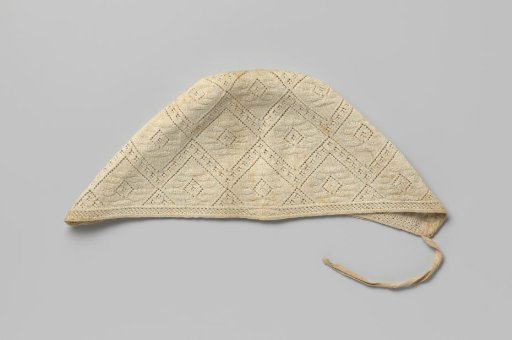 Knitted cap of white cotton with closely knitted diamond-shaped patterns