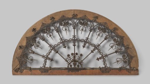 Iron arch filling, half-circular and set in an oak frame.