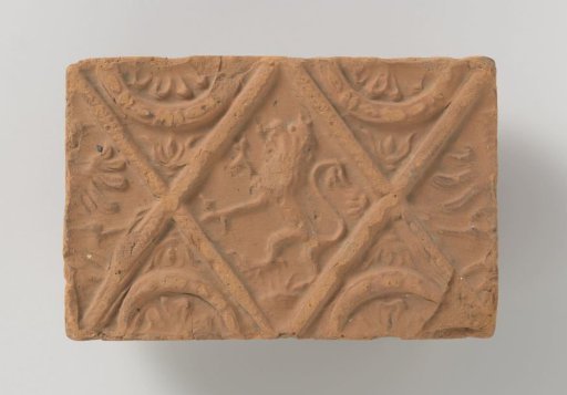 Fireplace stone with a lion in diamond shape
