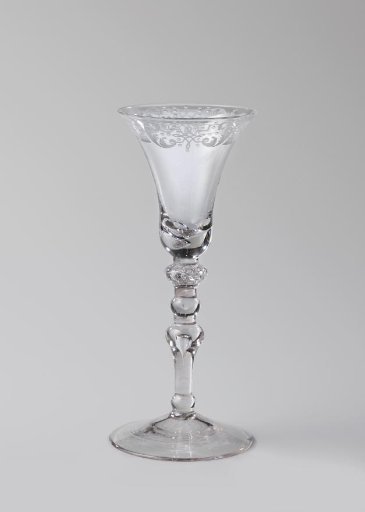 Chalice glass with an ornamental border