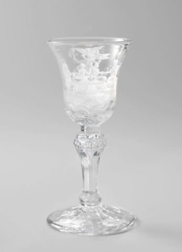 Wine glass with a drinking party and a bacchante on a vat