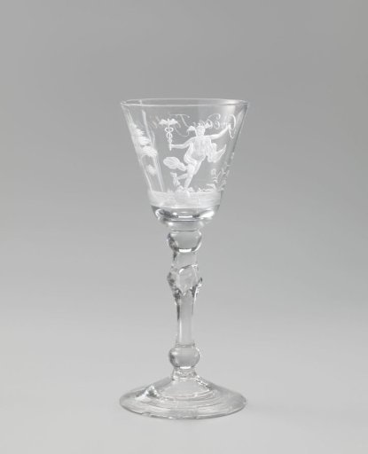 Wine glass with Mercury balancing on a ball