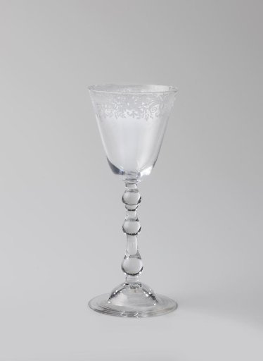 Chalice glass with an ornamental border