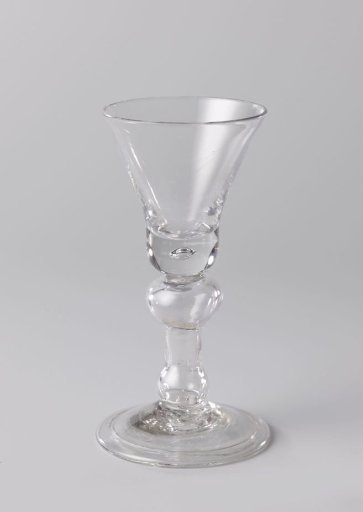 Chalice glass with an enclosed three-pence coin from 1713