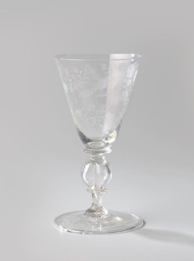 Chalice glass with flower branches, insects, and three peacocks