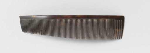 Hair comb or comb of plain fine imitation tortoiseshell and horn with a long row of narrow teeth, tapering