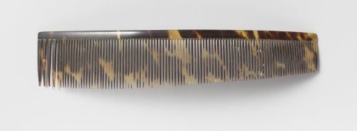 Hair comb or comb of plain fine imitation tortoiseshell, with a long row of narrow teeth, tapering