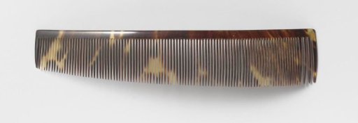 Hair comb or comb of imitation tortoiseshell, with a long row of narrow teeth, tapering