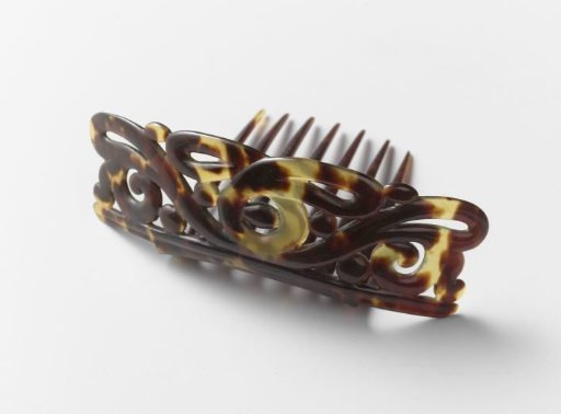Hair Comb of Imitation Tortoiseshell or Horn with an Openwork Carved Back of Delicate Interlacing Curls, Perpendicular to the Teeth
