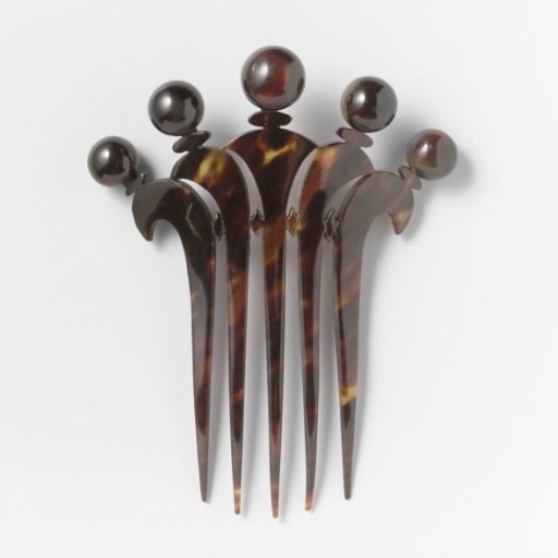 Hair Comb of Imitation Tortoiseshell or Horn with a Pointed Carved Back Decoration Featuring Five Spheres