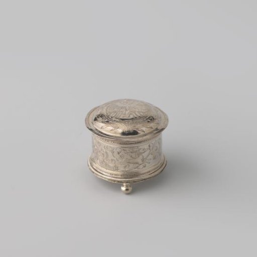 Knot box on three ball feet. Sides engraved with leaf garlands and animal figures; on the lid two hands and a heart pierced by two arrows.