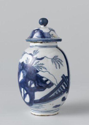 Covered pot in blue-painted faience with a depiction of two board players and rocks