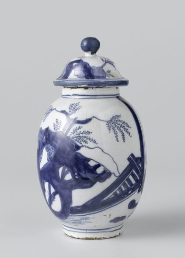Lidded pot of blue-painted faience with a scene of two board players and rocks