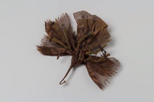 Corsage of brown ribbon with print, brown gauze woven with gold thread and gold thread trimmings