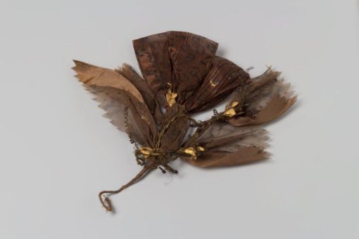 Bodice of brown ribbon with print, brown gauze woven with gold thread and gold thread tassels