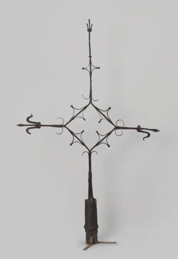 Tower cross decorated with lilies at the points