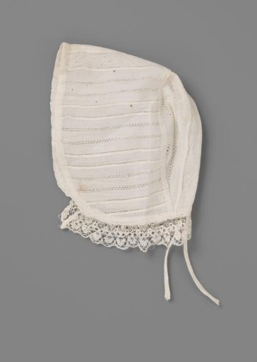 Baby cap of linen batiste with raised work and openwork, and a border of Brussels lace