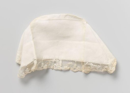 Baby cap with ornaments and openwork, trimmed with Mechlin lace