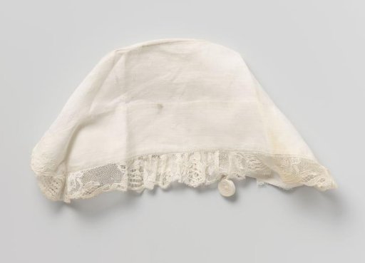 Baby cap with ornaments and openwork, trimmed with Mechlin lace