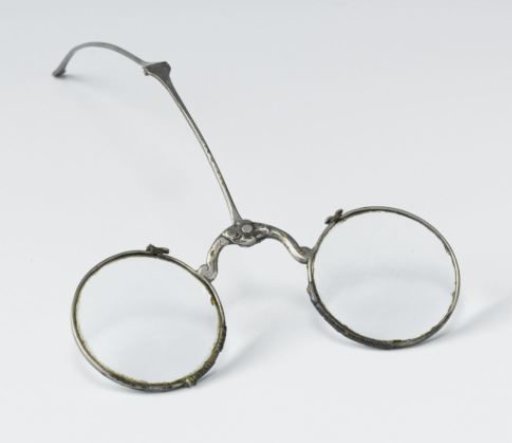 Spectacles with silver frame and polished round lenses